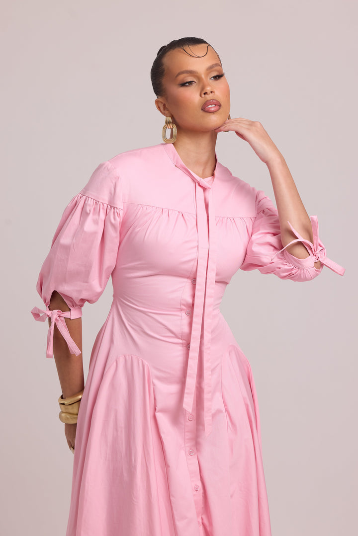 pink cotton dress with lace-up back and curved waist cut-out