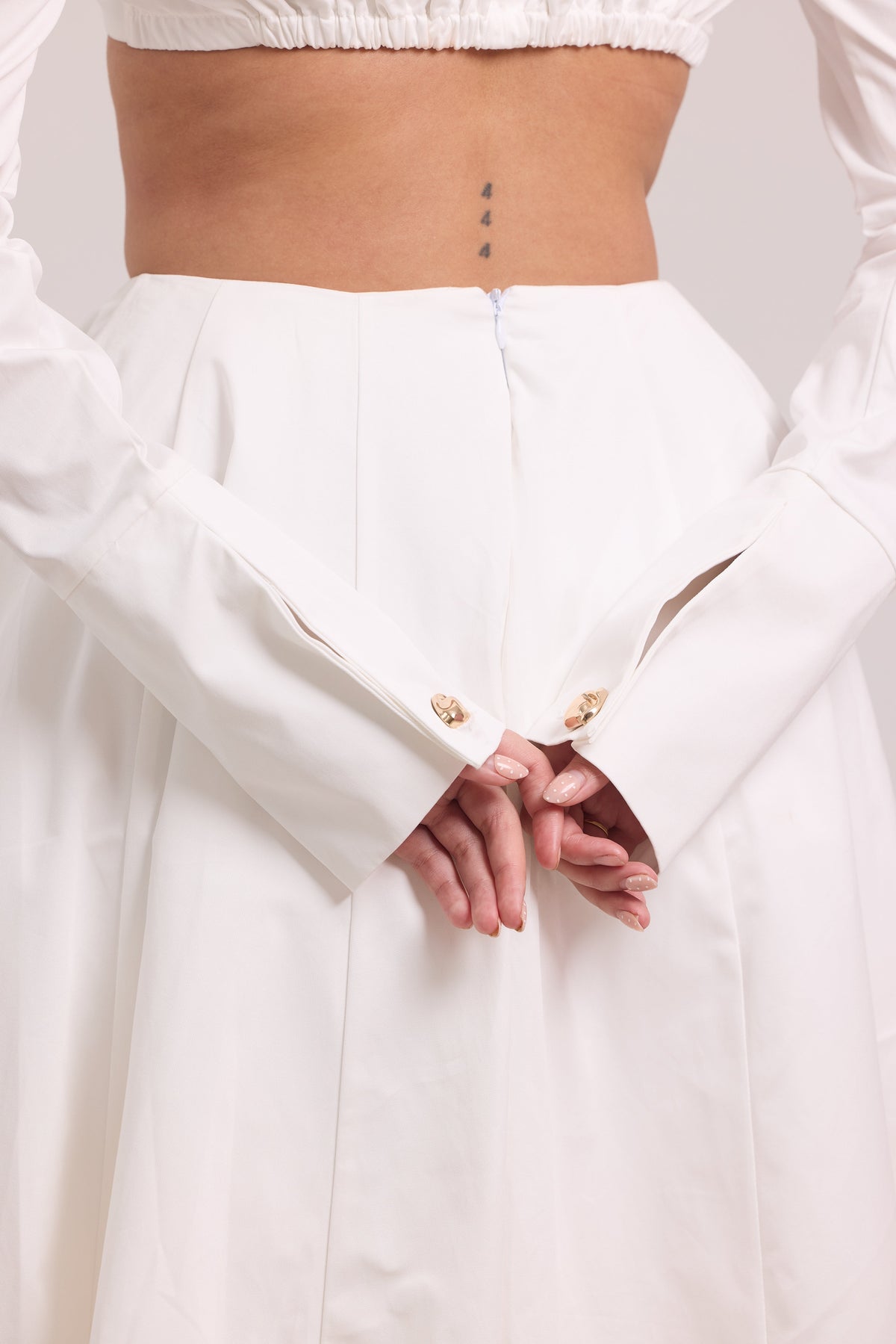 Pleated long-sleeve crop top with defined under-bust seams