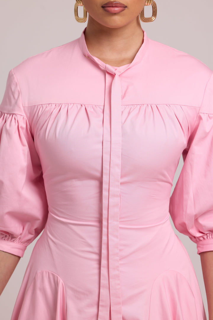 pink button-down shirt dress with voluminous sleeves and fitted waist