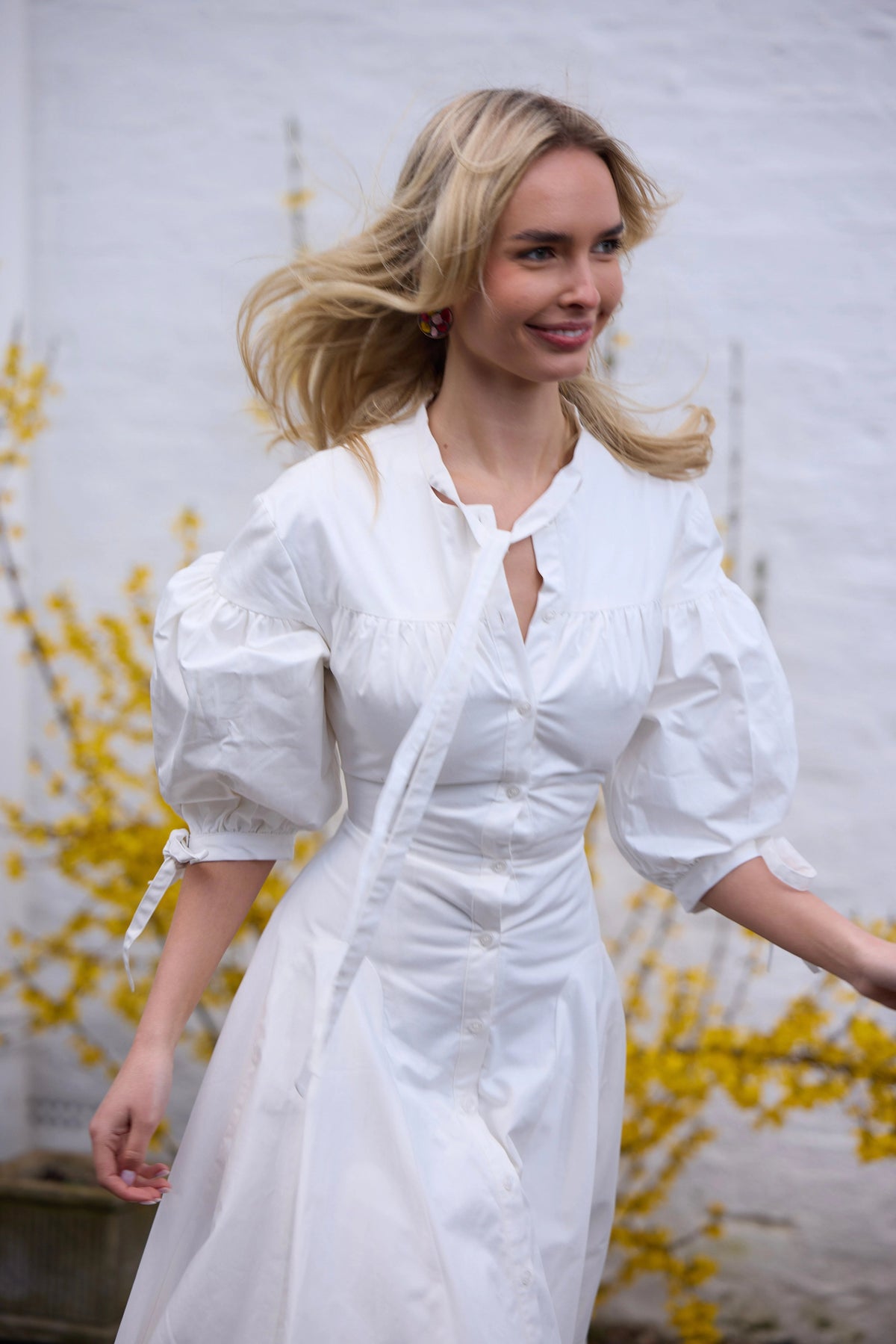 White button-down shirt dress with voluminous sleeves and fitted waist