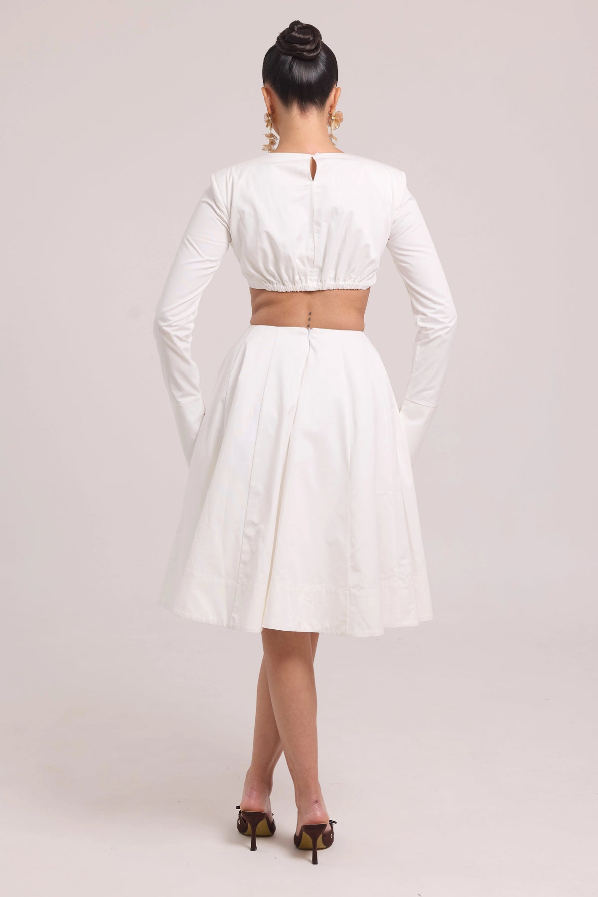 Long-sleeve crop top with contoured seams and matching full skirt