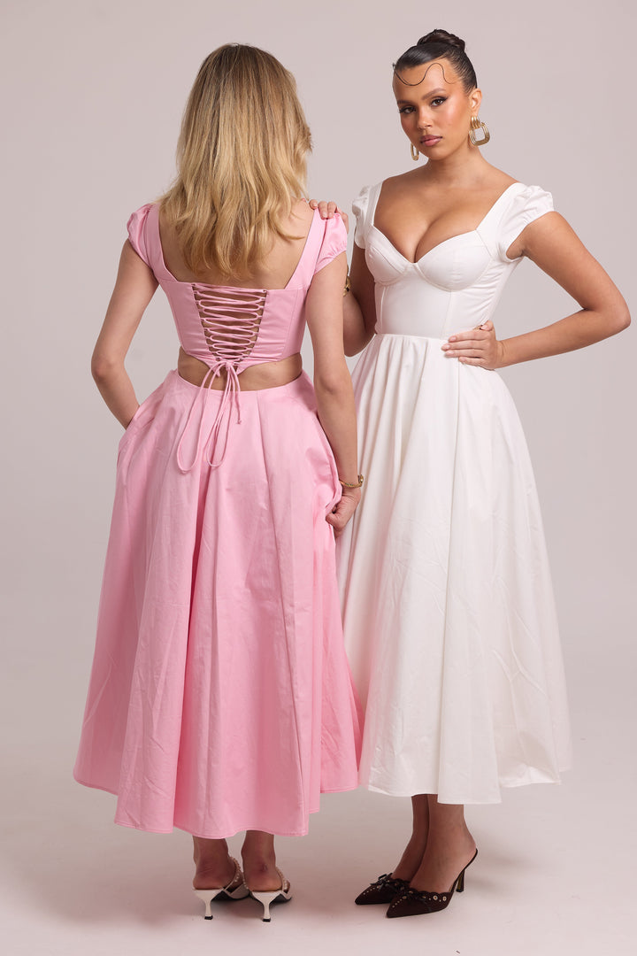 Structured cotton dress with full skirt and subtle waist cut-out