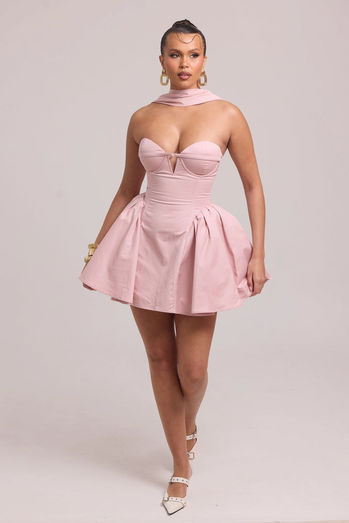 Structured mini dress with fitted bodice and sculptural volume at hips
