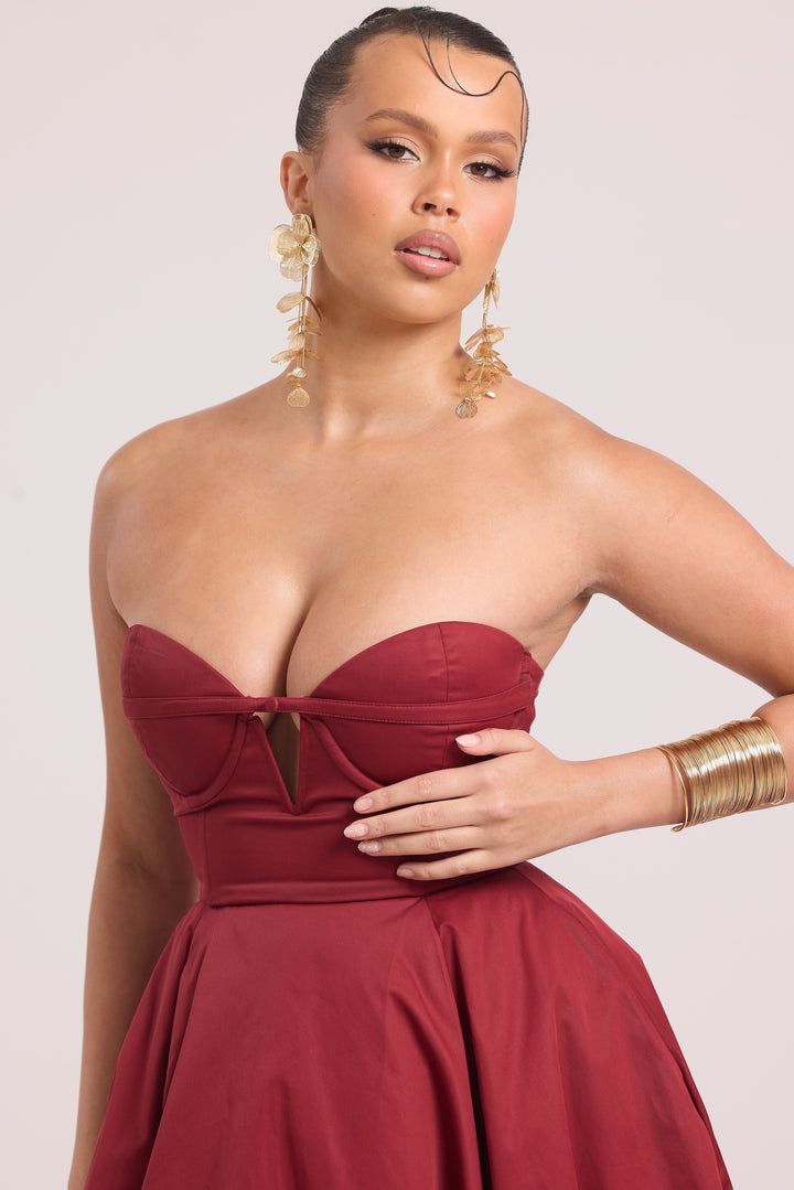 Close up shot of strapless burgundy dress 
