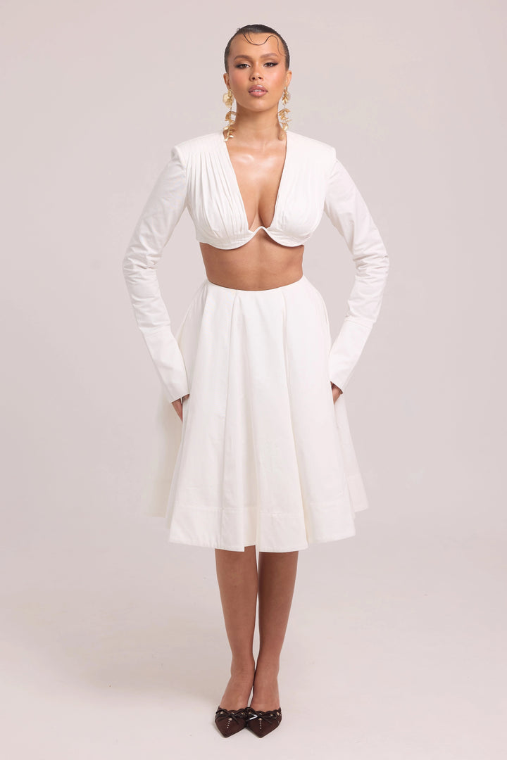 Two-piece set with pleated long-sleeve crop top and full skirt