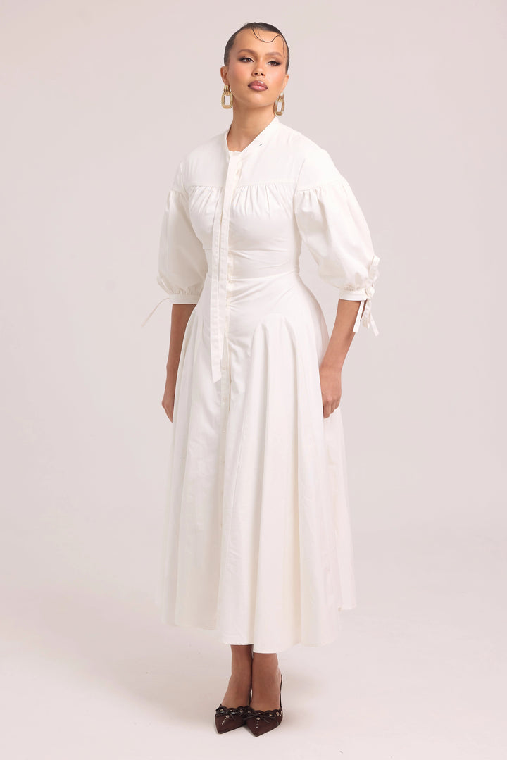 White cotton dress with structured bodice and full skirt